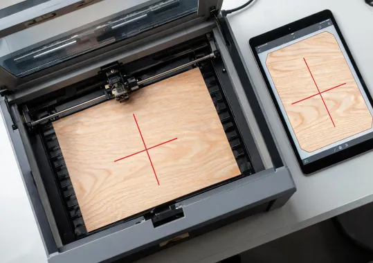 Overhead Glowforge camera aligning artwork on maple plywood