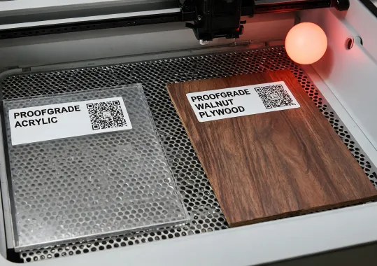 Proofgrade acrylic sheet with auto settings label inside laser bed